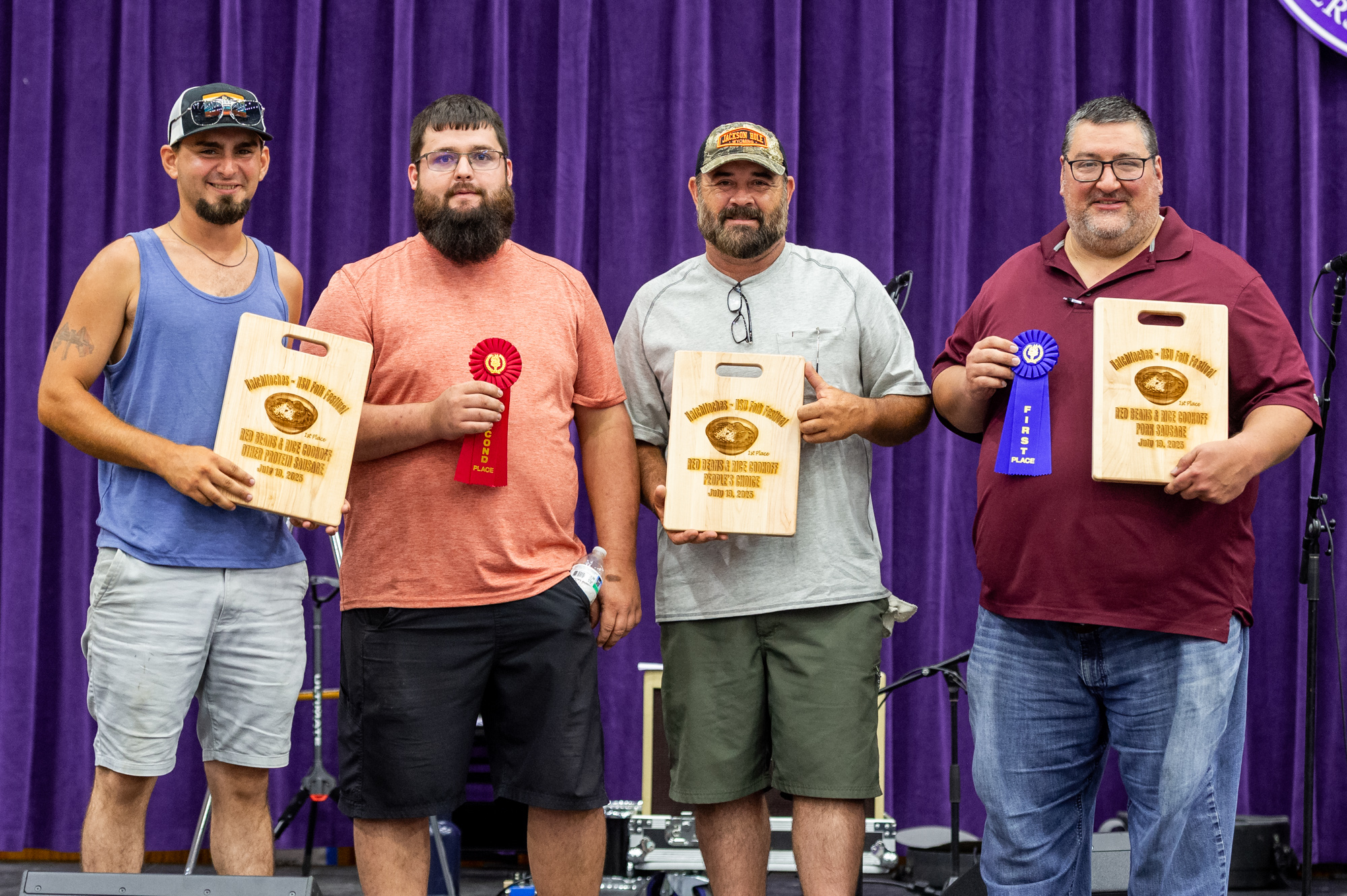 Winners of the Natchitoches-NSU Folk Festival Red Beans & Rice Cookoff were, from left, second place and People's Choice winners 3 Stooges, Jacob Carpenter of Belmont, Daniel Warren of Robeline and C.J. Vercher of Provencal, and first place Judge’s Choice winner Dane Terrell of Natchitoches. 
